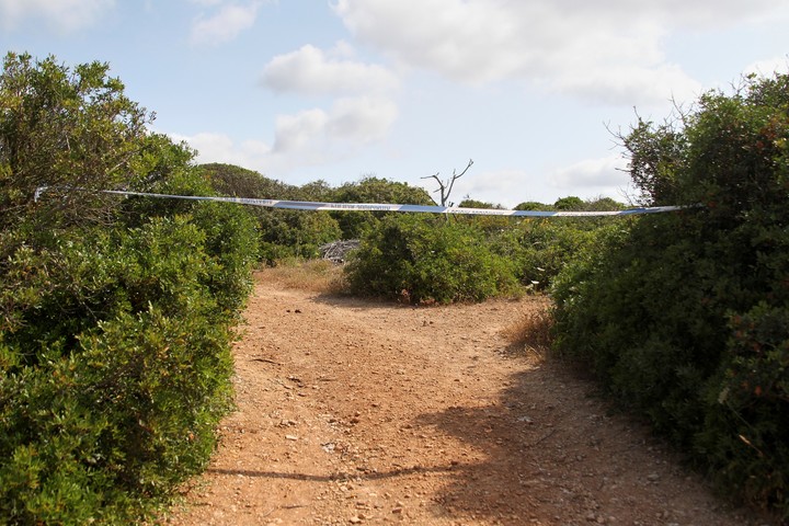 A dirt road is blocked with police tape where Portuguese and German police investigating the 2007 disappearance of British toddler Madeleine McCann carry out searches near Lagos, southern Portugal Tuesday, June 3, 2025. (AP Photo/Joao Matos)
